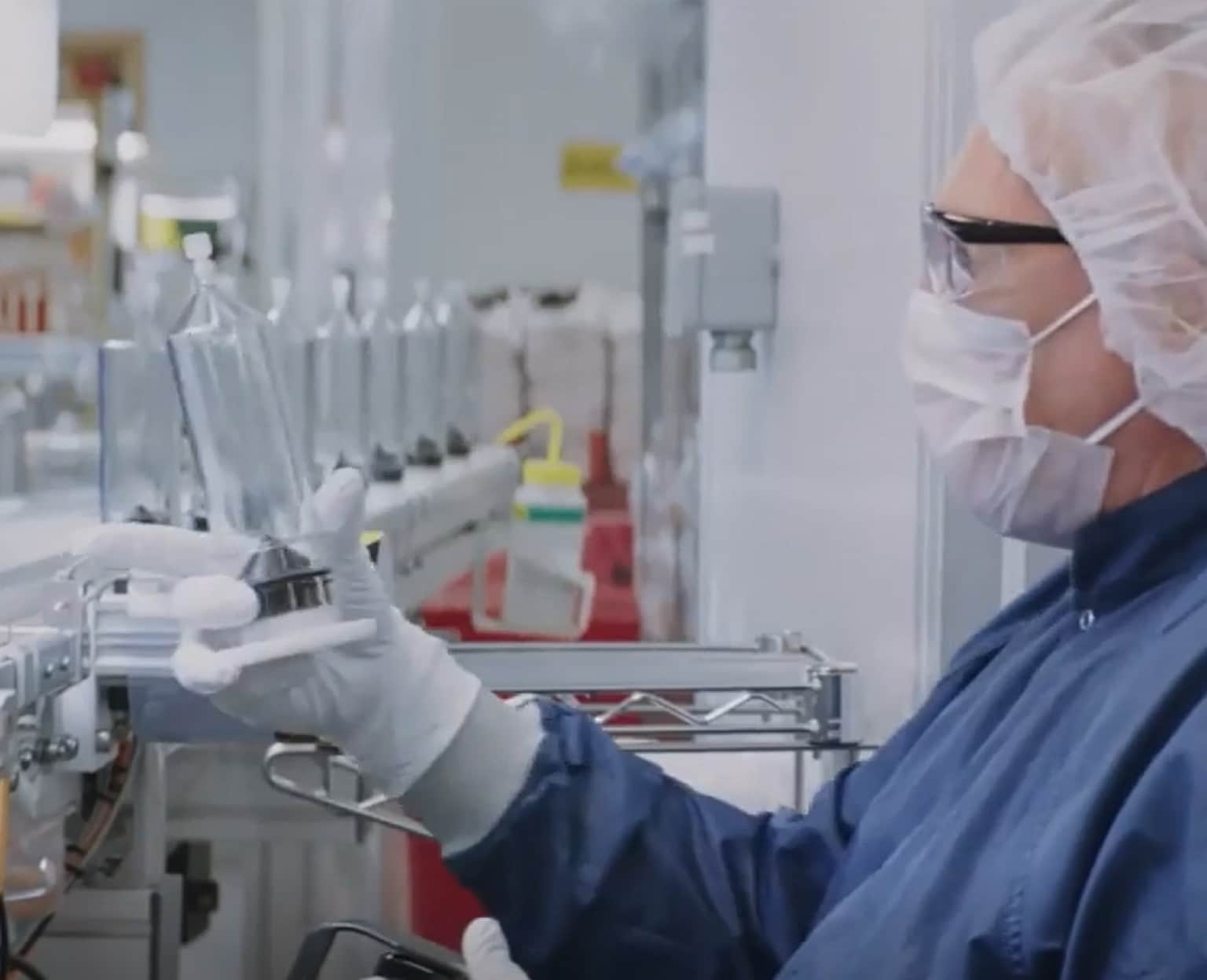 A researcher carefully operating an injector system